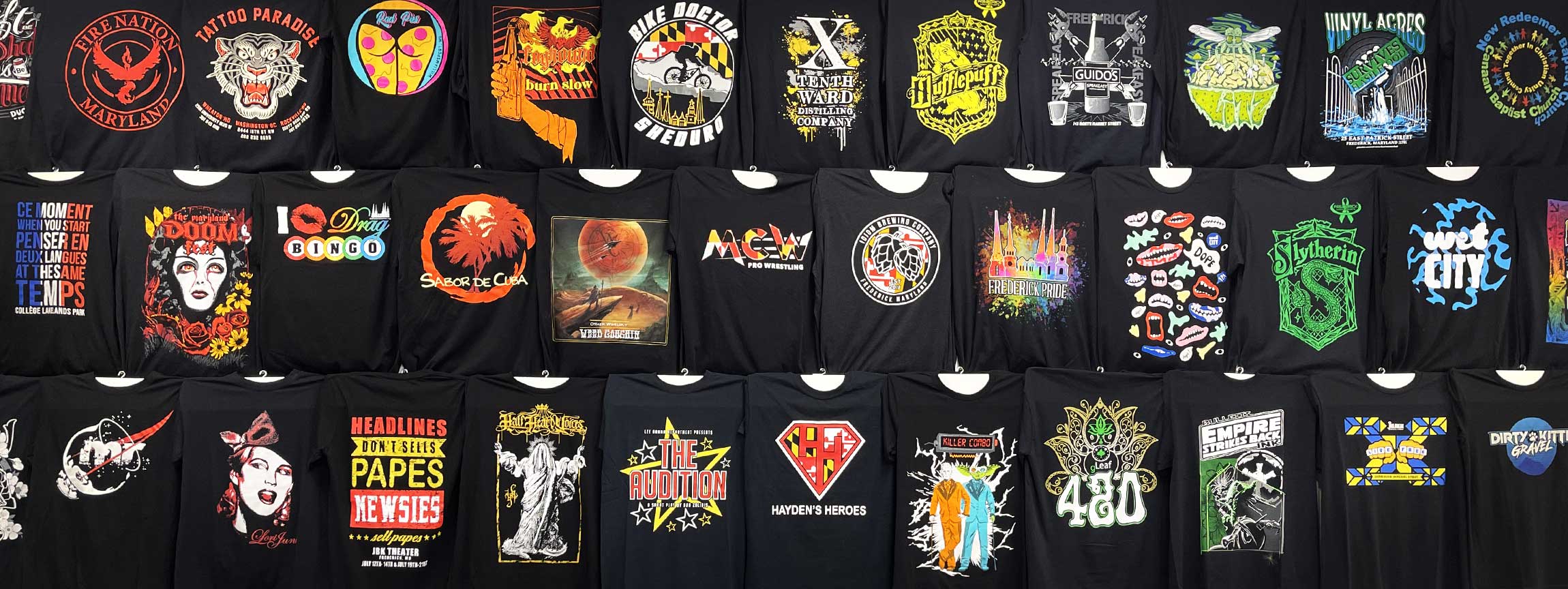 Wall display showing many colorful prints and designs